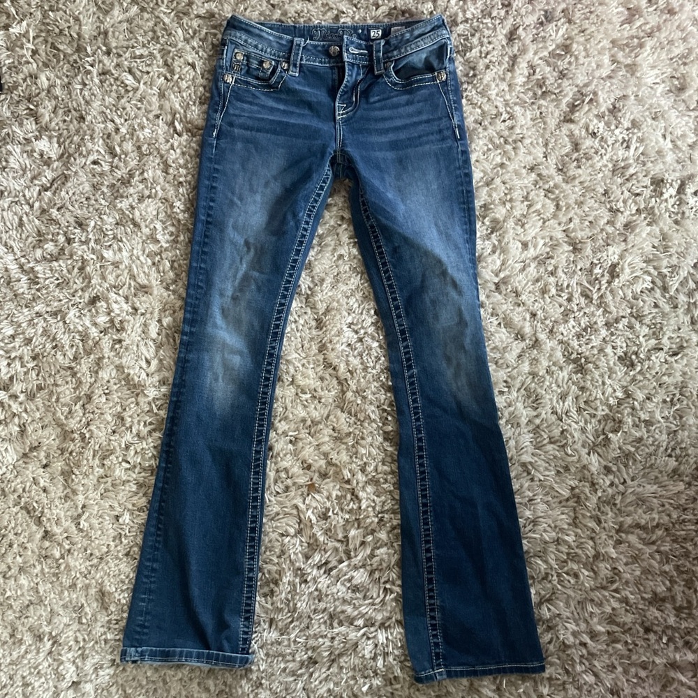 Low rise Bootcut flare miss me jeans. Waist says 25. Inseam says 34.